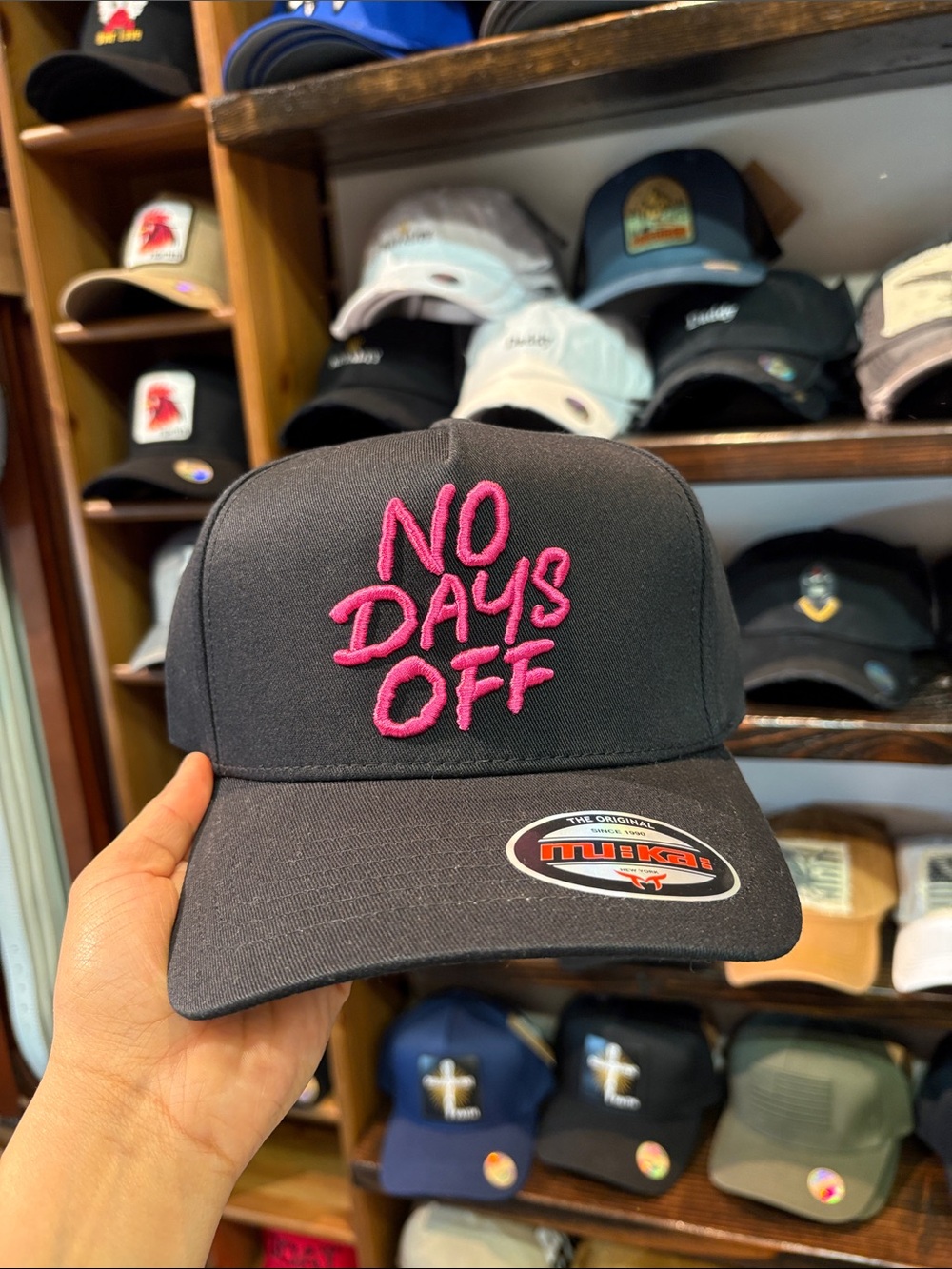 No Days Off Embroidered Trucker Hat - Black with Pink Lettering